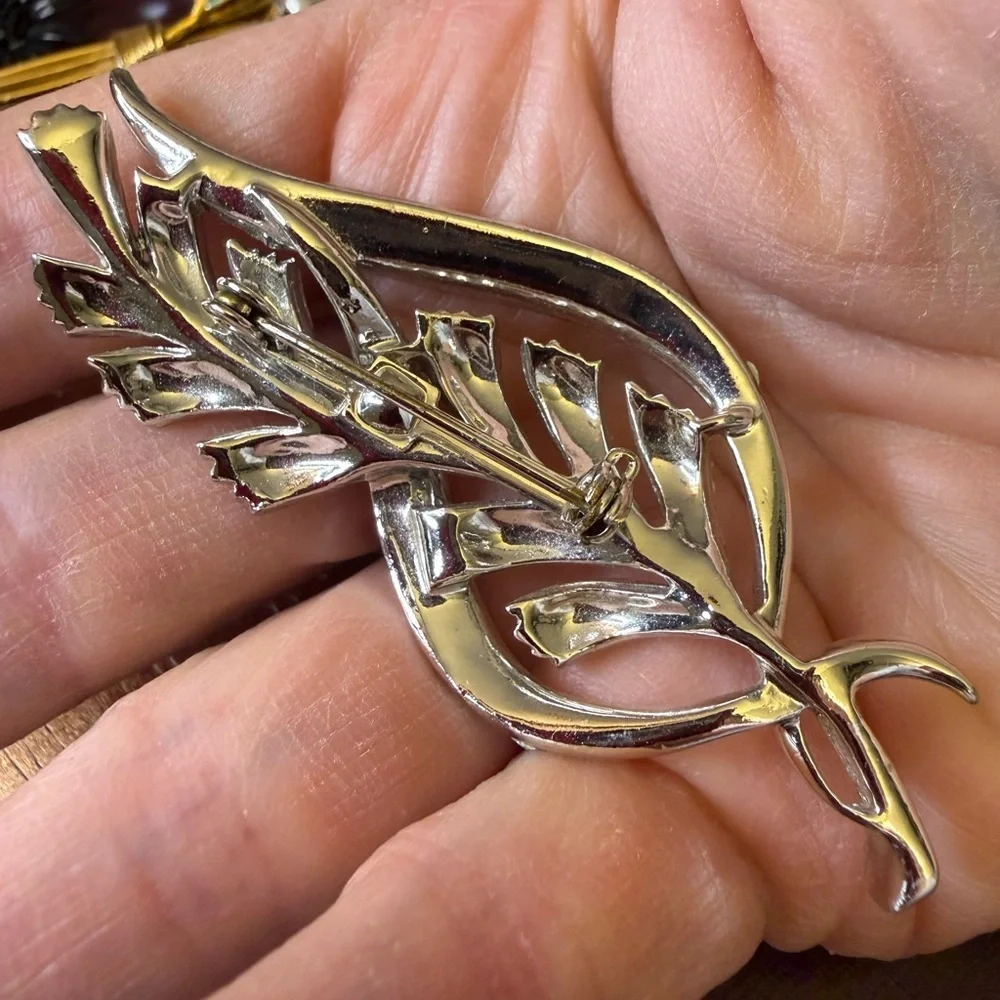 Vintage Coro stylized leaf brooch with aurora borealis rhinestones.